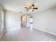 Bedroom with tile flooring, ceiling fan, and closet at 410 Lark Ct, Kissimmee, FL 34759