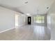 Open living space with tile flooring and natural light, ready for personalization at 410 Lark Ct, Kissimmee, FL 34759