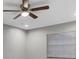 Neutral bedroom featuring a ceiling fan and large window for ample natural light at 4172 Stonehenge Rd, Mulberry, FL 33860