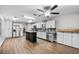 Bright, modern kitchen with white cabinetry, stainless appliances, and a center island with butcher block at 4172 Stonehenge Rd, Mulberry, FL 33860