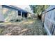 Fenced backyard featuring lawn and shade with space to relax and entertain next to the home at 419 Cierra Oaks Cir, Lady Lake, FL 32159