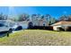 Charming single-story home features a well-manicured lawn and attached two-car garage at 419 Cierra Oaks Cir, Lady Lake, FL 32159
