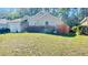 Charming single-story home features a well-manicured lawn and attached two-car garage at 419 Cierra Oaks Cir, Lady Lake, FL 32159