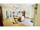 Spacious living room features neutral walls, carpet flooring, and natural light at 419 Cierra Oaks Cir, Lady Lake, FL 32159