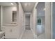 Hallway view connecting a bathroom to a bedroom and the main living area at 421 Britten Dr, Kissimmee, FL 34758