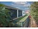 Comfortable screened-in lanai and fenced backyard bordered by lush landscaping for privacy at 461 Treviso Dr, Poinciana, FL 34759