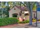 Exterior shot of a charming building with red tile roof and lush landscaping at 461 Treviso Dr, Poinciana, FL 34759