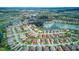 Community aerial view highlighting community with ponds, golf course and lush landscape for a serene lifestyle at 461 Treviso Dr, Poinciana, FL 34759