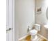Half bathroom with a toilet, and a sink with wood-look tile flooring at 461 Treviso Dr, Poinciana, FL 34759