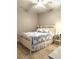 Bedroom featuring a bed with blue and white patterned bedding and a ceiling fan at 461 Treviso Dr, Poinciana, FL 34759