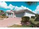 Exterior of home featuring a brick driveway and a three car garage at 461 Treviso Dr, Poinciana, FL 34759