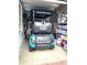 Garage view with the golf cart parked inside, offering convenient storage and recreation access at 461 Treviso Dr, Poinciana, FL 34759