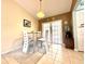 Cozy dining area with modern table set and door to backyard at 602 N Delmonte Ct, Kissimmee, FL 34758