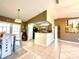 Bright dining area with tile floors adjacent to an open kitchen layout at 602 N Delmonte Ct, Kissimmee, FL 34758