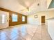 Spacious living room featuring tiled flooring, neutral paint colors, and a ceiling fan at 602 N Delmonte Ct, Kissimmee, FL 34758