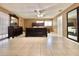 Expansive main bedroom featuring tile flooring, ceiling fan, and ample space for relaxation and rest at 602 N Delmonte Ct, Kissimmee, FL 34758