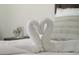 Charming bedroom featuring decorative towel swans, adding a touch of elegance and comfort to the space at 6165 Carrier Dr # 2108, Orlando, FL 32819
