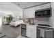 Open-concept living room, kitchen, and bedroom area with natural light and modern design at 6165 Carrier Dr # 2108, Orlando, FL 32819