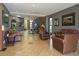 A well-lit lobby with tile floor and comfortable leather chairs and couches for relaxing at 6165 Carrier Dr # 2108, Orlando, FL 32819