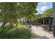 Seating area in front of building covered in trees at 6165 Carrier Dr # 2108, Orlando, FL 32819