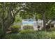 Beautiful pool area with well-maintained landscaping, privacy fence and surrounding trees at 6165 Carrier Dr # 2108, Orlando, FL 32819