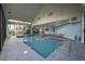 Indoor pool with a spacious deck area for lounge chairs and seating, offering year-round enjoyment at 6165 Carrier Dr # 2108, Orlando, FL 32819