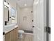 Modern bathroom with tiled shower, floating vanity, and contemporary fixtures at 6862 Se 23Rd Ave, Ocala, FL 34480