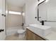 Modern bathroom features a large mirror, vessel sink, and a bathtub with light colored tile at 6862 Se 23Rd Ave, Ocala, FL 34480