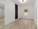 Bright bedroom with light floors, white walls, modern lighting, and a view to the outside at 6862 Se 23Rd Ave, Ocala, FL 34480