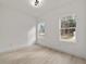 Cozy bedroom with wood-style flooring and windows providing natural light at 6862 Se 23Rd Ave, Ocala, FL 34480