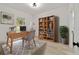Bright home office features a wooden desk and ample storage shelves, with a window view to the outdoors at 6862 Se 23Rd Ave, Ocala, FL 34480