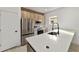 Kitchen features quartz countertops, wood accent cabinets, and stainless steel appliances at 6862 Se 23Rd Ave, Ocala, FL 34480