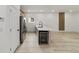 Modern kitchen with stainless steel appliances, a wine cooler, and quartz countertops at 6862 Se 23Rd Ave, Ocala, FL 34480