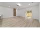 A bright room with a sliding glass door to the outside and a wood accent wall at 6862 Se 23Rd Ave, Ocala, FL 34480