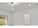 Bright room with wood grain floors and a sliding glass door that allows ample light in at 6862 Se 23Rd Ave, Ocala, FL 34480