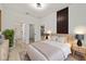 Tranquil main bedroom featuring a stylish bed, contemporary furniture, and an en-suite bathroom at 6862 Se 23Rd Ave, Ocala, FL 34480