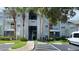 Condo building exterior with mature landscaping and convenient parking at 709 Secret Harbor Ln # 213, Lake Mary, FL 32746