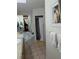 Bright bathroom with a large soaking tub, walk-in shower, and neutral tile flooring at 7143 Edgewater Shores Ct, Orlando, FL 32810
