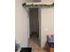Hallway with neutral walls, tile floors, and multiple doorways at 7143 Edgewater Shores Ct, Orlando, FL 32810