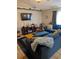 Inviting living room featuring cozy blue sofa and modern decor at 7143 Edgewater Shores Ct, Orlando, FL 32810