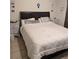 Cozy main bedroom with large bed and bedside tables at 7143 Edgewater Shores Ct, Orlando, FL 32810