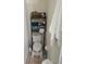 Toilet area with storage shelves and towel rack at 7143 Edgewater Shores Ct, Orlando, FL 32810