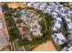 Community aerial view showcasing homes with community pool and splashpad at 7848 Somersworth Dr, Kissimmee, FL 34747