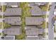Aerial view showcasing multiple homes, green spaces, and streets in the residential community at 7848 Somersworth Dr, Kissimmee, FL 34747