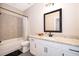 Bathroom featuring granite countertops and modern fixtures and white cabinetry at 7848 Somersworth Dr, Kissimmee, FL 34747