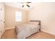 Bedroom with carpet and a bed, with neutral colored walls and window with blinds at 7848 Somersworth Dr, Kissimmee, FL 34747