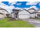 Beautiful single Gathering home with a two car garage and landscaped front yard at 7848 Somersworth Dr, Kissimmee, FL 34747