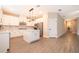 Modern kitchen featuring white cabinets, an island, and stainless steel appliances at 7848 Somersworth Dr, Kissimmee, FL 34747