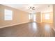 Bright, open living room with wood-look flooring and lots of natural light at 7848 Somersworth Dr, Kissimmee, FL 34747
