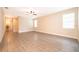 Large living area with ample natural light and stylish wood-look flooring at 7848 Somersworth Dr, Kissimmee, FL 34747